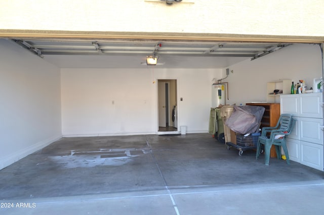 garage with washing machine and dryer and a garage door opener