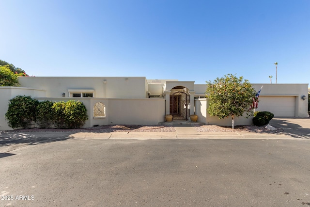 southwest-style home with a garage