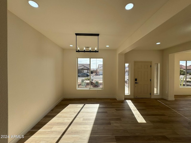 foyer entrance with recessed lighting, dark wood finished floors, and baseboards