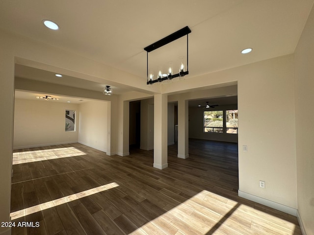 spare room featuring ceiling fan and dark hardwood / wood-style floors