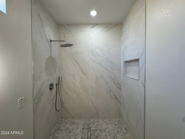 bathroom with a shower stall