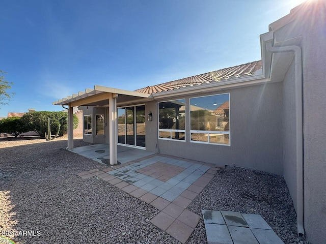 rear view of house with a patio