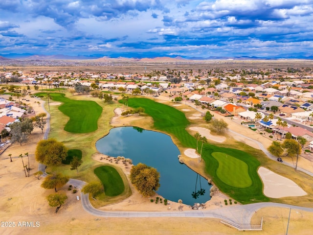 bird's eye view with golf course view, a residential view, and a water and mountain view