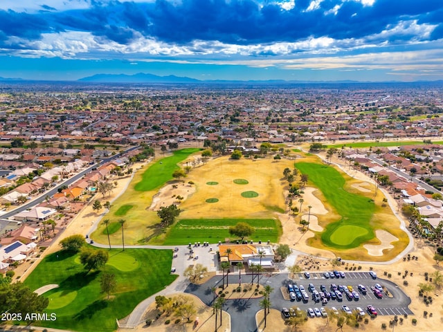 bird's eye view with a mountain view and golf course view