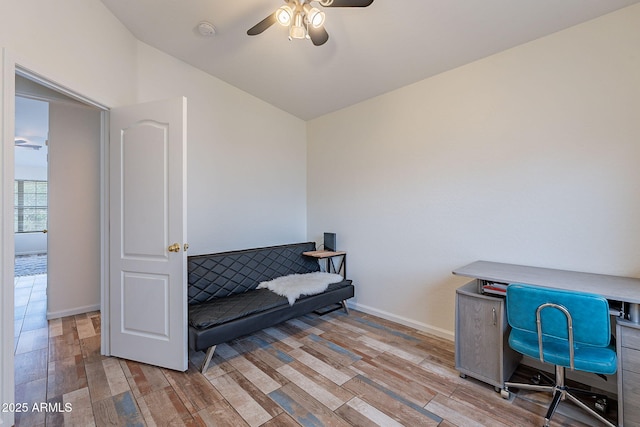 2731 E Windsor Ave, Phoenix, AZ 85008 - living area with ceiling fan, wood finished floors, baseboards, lofted ceiling, and a desk