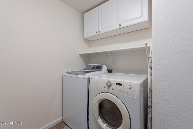 2731 E Windsor Ave, Phoenix, AZ 85008 - washroom featuring cabinet space, washer and dryer, a textured wall, light wood-style floors, and baseboards