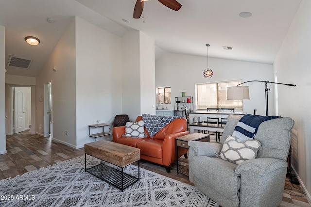 2731 E Windsor Ave, Phoenix, AZ 85008 - living room featuring vaulted ceiling, ceiling fan, wood finished floors, and baseboards