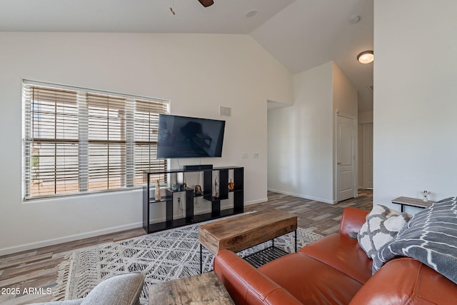 2731 E Windsor Ave, Phoenix, AZ 85008 - living area featuring baseboards, ceiling fan, wood finished floors, and high vaulted ceiling