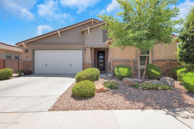 4853 N 183rd Ln, Goodyear, AZ 85395 - view of front of house with stone siding, a garage, concrete driveway, and stucco siding