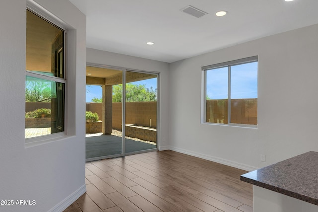 4853 N 183rd Ln, Goodyear, AZ 85395 - unfurnished room featuring baseboards, recessed lighting, and wood finished floors
