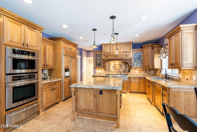 kitchen with a sink, glass insert cabinets, a warming drawer, paneled appliances, and a center island