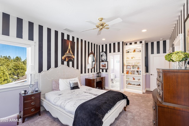 bedroom featuring visible vents, carpet floors, wallpapered walls, ensuite bath, and recessed lighting