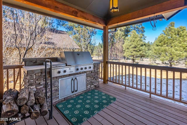 wooden terrace with area for grilling and grilling area
