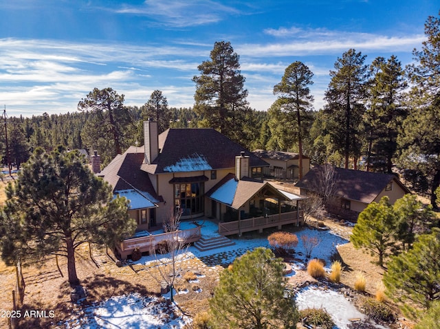 aerial view featuring a wooded view
