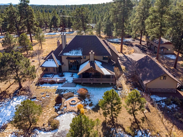 birds eye view of property with a wooded view