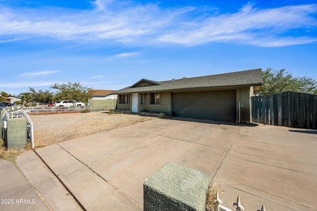 6171 W Mckinley St, Phoenix, AZ 85043 - ranch-style house featuring stucco siding, fence, an attached garage, a shingled roof, and concrete driveway
