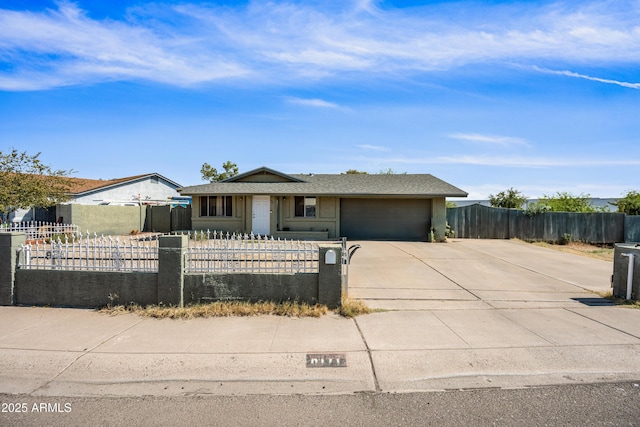 6171 W Mckinley St, Phoenix, AZ 85043 - view of front of home with driveway, an attached garage, and a fenced front yard
