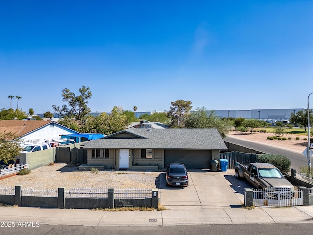 6171 W Mckinley St, Phoenix, AZ 85043 - single story home featuring driveway, a shingled roof, a garage, and a fenced front yard