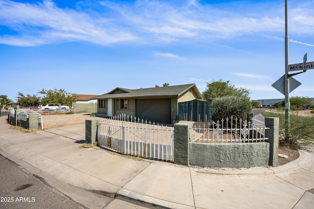 6171 W Mckinley St, Phoenix, AZ 85043 - bungalow-style home featuring concrete driveway, a fenced front yard, and a garage