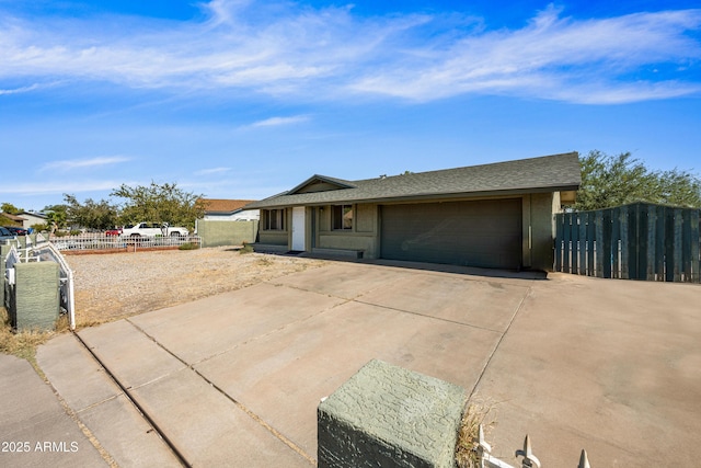 6171 W Mckinley St, Phoenix, AZ 85043 - single story home featuring a garage, roof with shingles, driveway, and fence