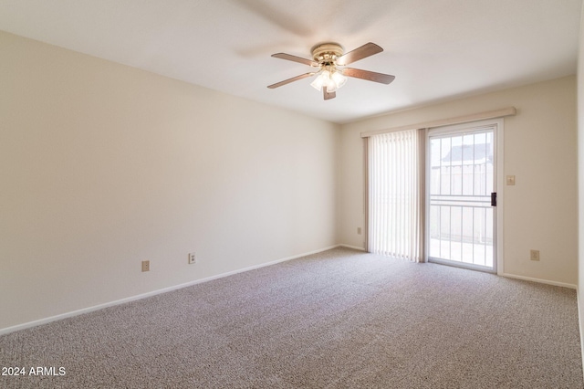 spare room with carpet floors and ceiling fan