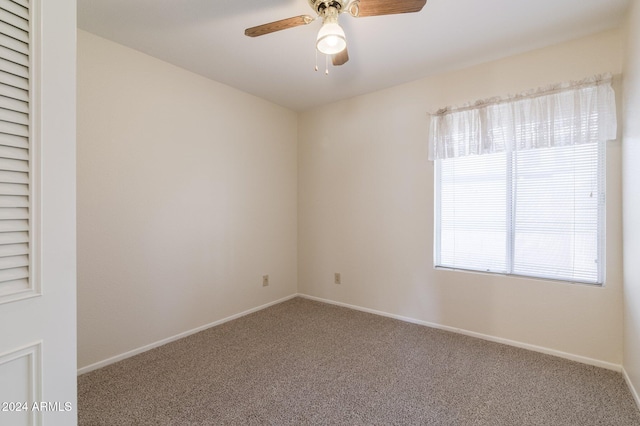 carpeted empty room with ceiling fan