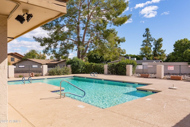 view of pool featuring a patio