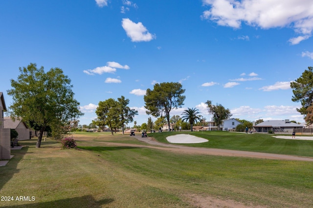 surrounding community featuring a lawn