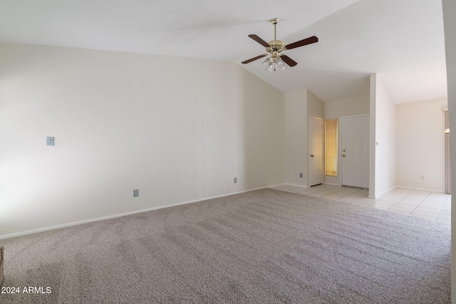 unfurnished room featuring lofted ceiling, ceiling fan, and light tile patterned flooring