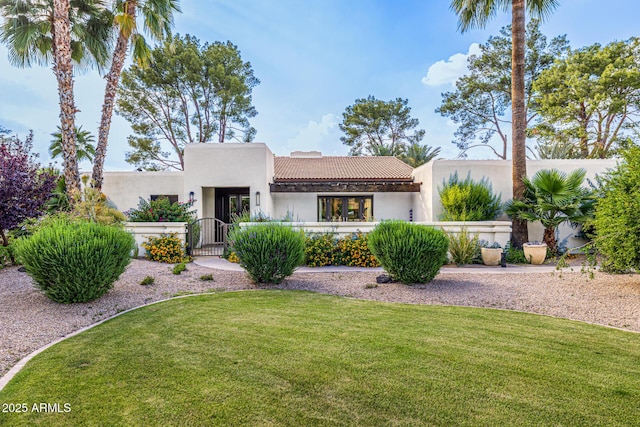 mediterranean / spanish-style house with a tiled roof and stucco siding