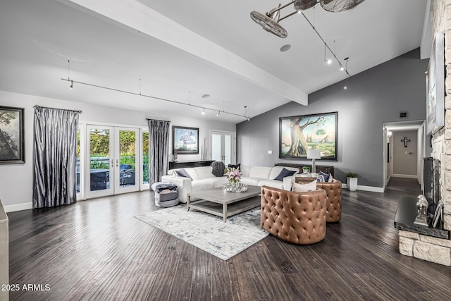living area featuring rail lighting, wood finished floors, french doors, baseboards, and vaulted ceiling