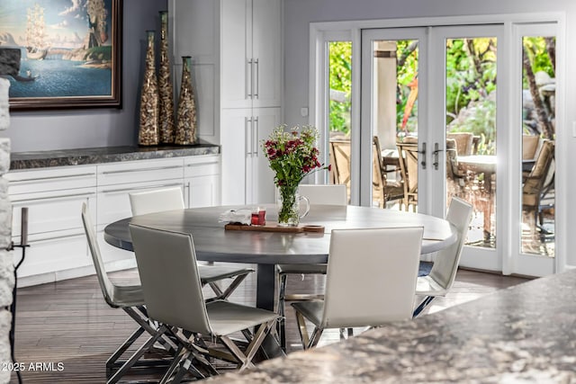 dining room with french doors and wood finished floors