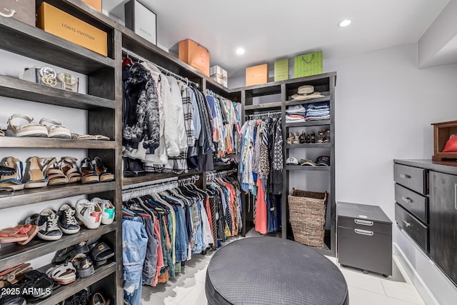 walk in closet featuring light tile patterned floors