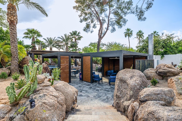 view of patio / terrace with an outdoor hangout area and fence