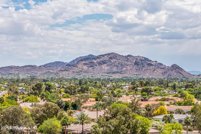 view of mountain backdrop featuring nearby suburban area