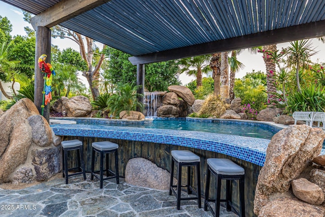 view of patio / terrace featuring an outdoor pool