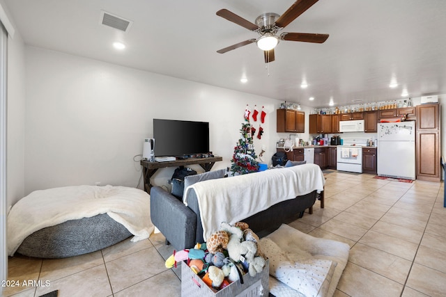 tiled living room featuring ceiling fan