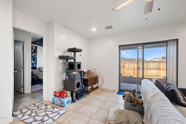 interior space featuring ceiling fan and light tile patterned floors