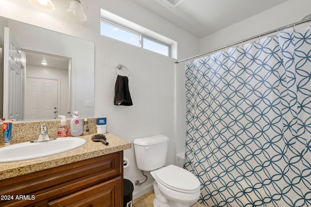 full bathroom with vanity, toilet, and shower / bath combo with shower curtain