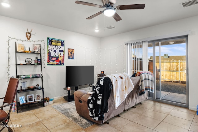 bedroom with ceiling fan, light tile patterned flooring, and access to exterior