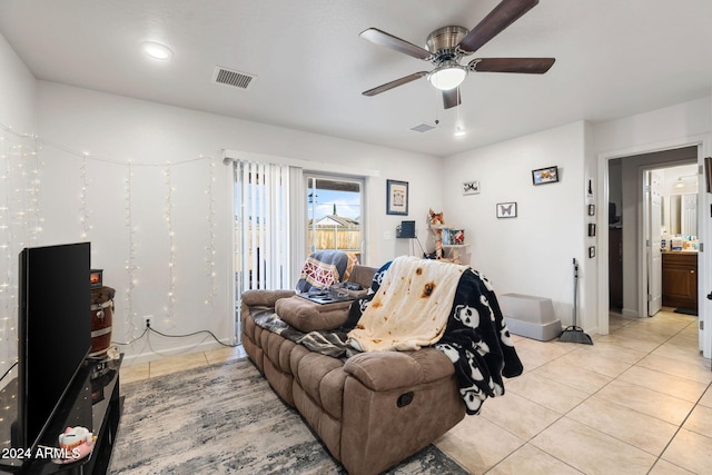 tiled living room featuring ceiling fan