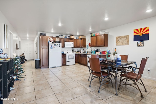 dining area with light tile patterned flooring