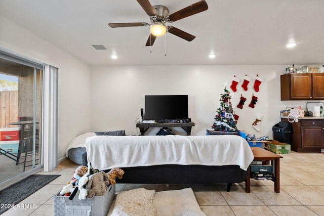 tiled living room featuring ceiling fan