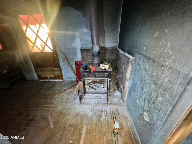 detailed view of a wood stove and wood finished floors