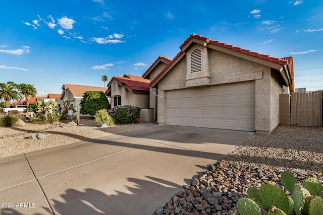 ranch-style house featuring a garage