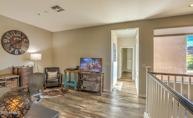 living area with dark hardwood / wood-style flooring