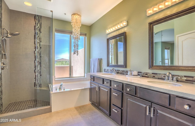 bathroom featuring independent shower and bath, vanity, and tile patterned flooring