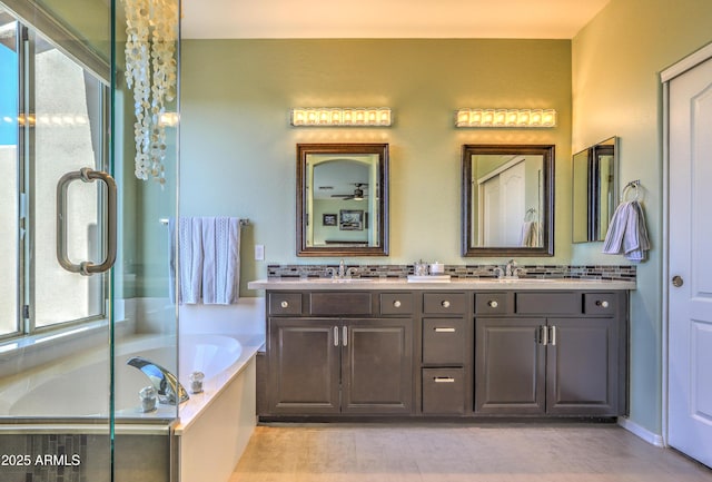 bathroom featuring vanity and a tub