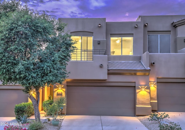 southwest-style home featuring a garage