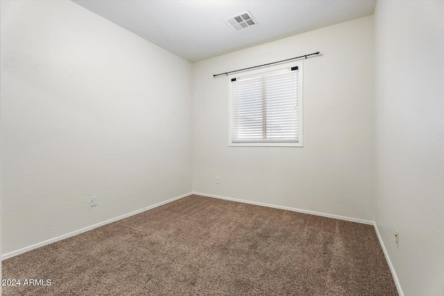 spare room with carpet floors